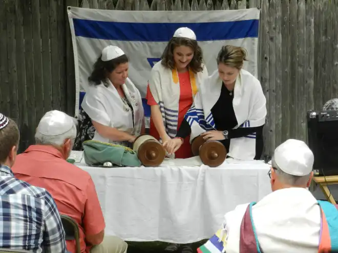 Bat Mitzvah and her family working with Rabbi Danielle G. Eskow